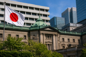 Bank of Japan headquarters in Tokyo with the Japanese flag, representing monetary policy, inflation expectations, and economic outlook.